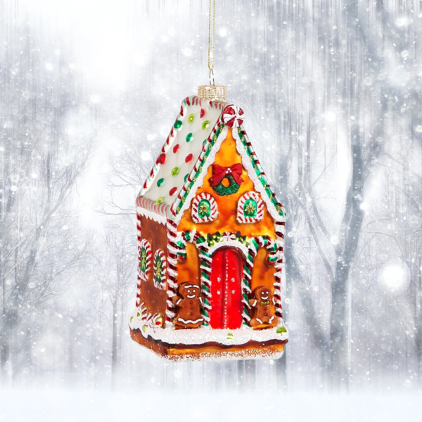 gingerbread house christmas tree ornament christmas bauble on a snow landscape background
